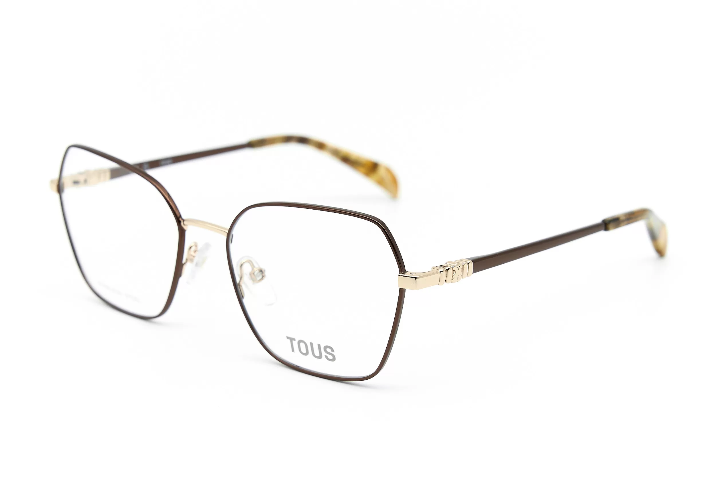 Женская оправа TOUS VTO463 COL0367 из окрашенного металла с коричневымм дужками и фирменным логотипом-мишкой