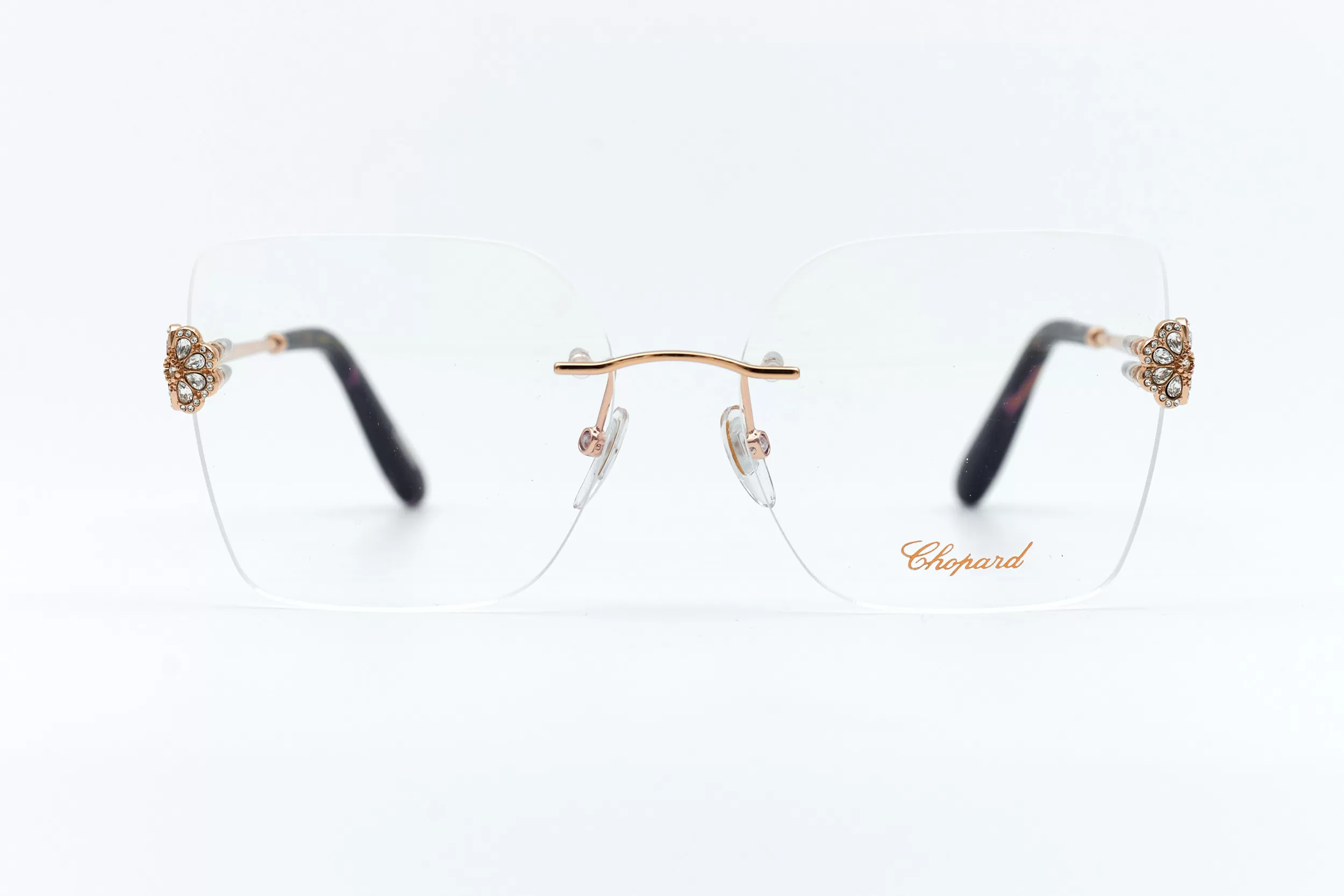 Женская оправа Chopard безободковая золотая оправа с декоративными ювелирными элементами в виде цветка с белыми кристаллами, фирменным логотипом и черепаховыми заушниками