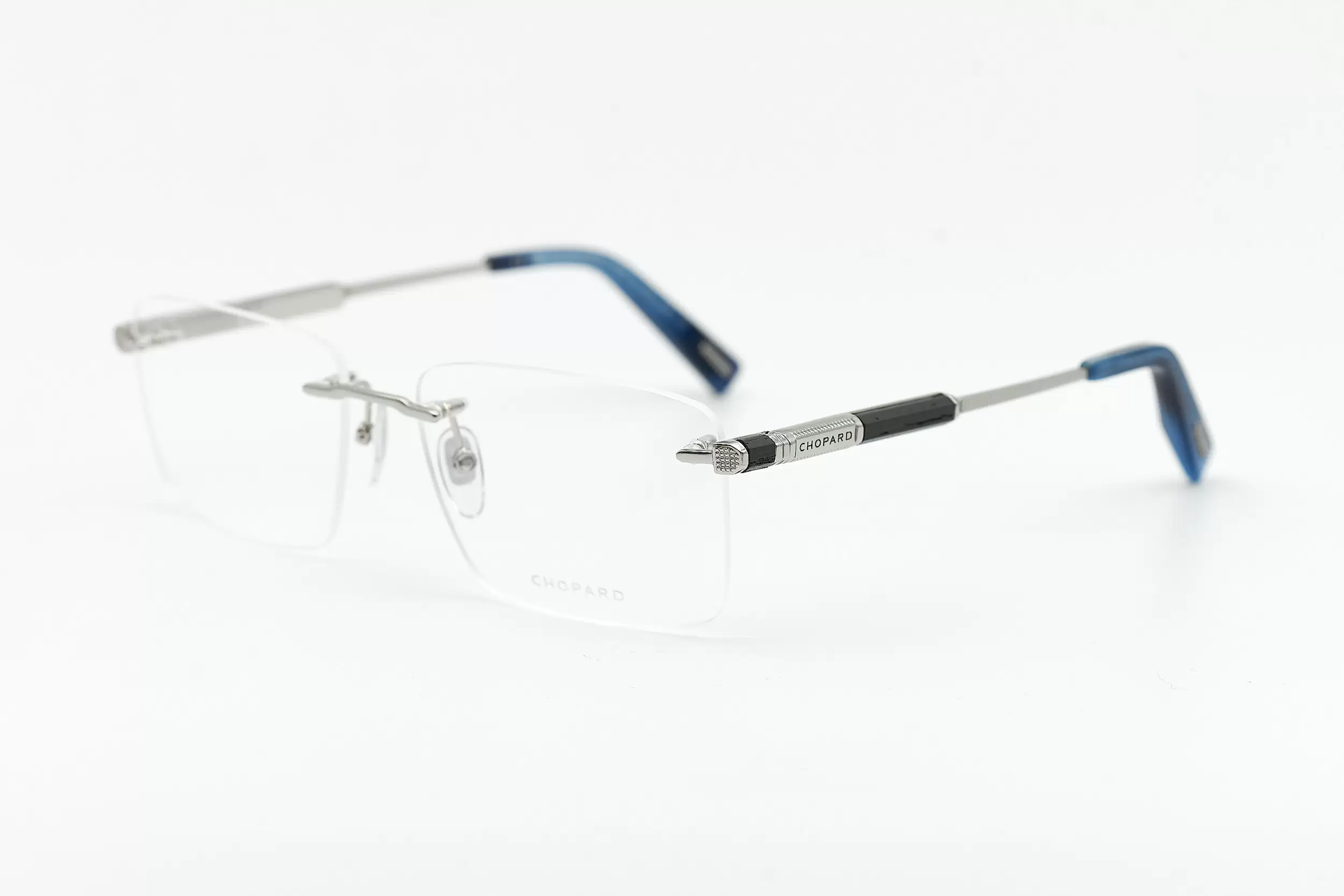 Мужская оправа Chopard безободковая оправа серебристого цвета, с ювелирными элементами, голубыми заушниками и вставками из ценных пород дерева